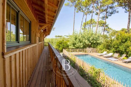 chambre élégante dans villa en location cap ferret, immobilier de prestige